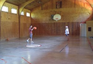 Inside the barn is a basketball court.